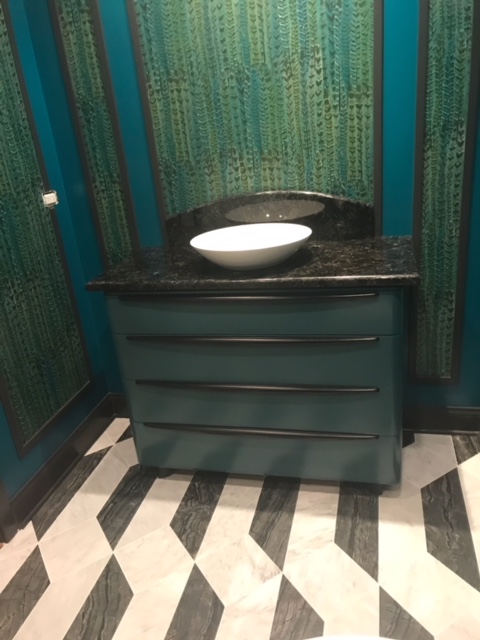 Bathroom sink with dark granite countertops